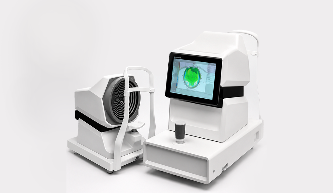 White ophthalmic imaging device with a touchscreen showing a green retinal map, ready for an eye exam.
